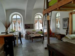 a living room with a couch and a table at Apartments in Villa Crusca in Bad Bleiberg