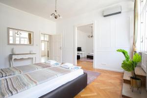 Posteľ alebo postele v izbe v ubytovaní Chic & Charm Apartment