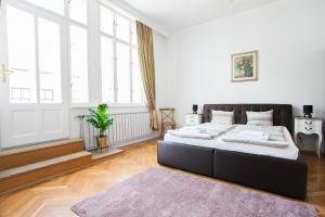 Posteľ alebo postele v izbe v ubytovaní Chic & Charm Apartment