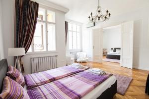 Posteľ alebo postele v izbe v ubytovaní Chic & Charm Apartment