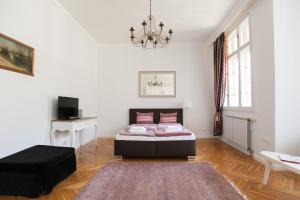 Posteľ alebo postele v izbe v ubytovaní Chic & Charm Apartment