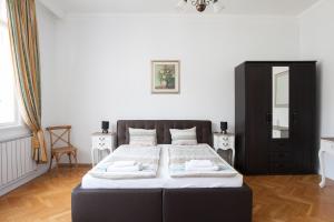 Posteľ alebo postele v izbe v ubytovaní Chic & Charm Apartment