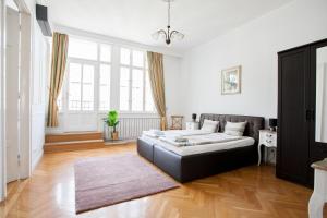 Posteľ alebo postele v izbe v ubytovaní Chic & Charm Apartment