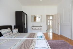 Posteľ alebo postele v izbe v ubytovaní Chic & Charm Apartment