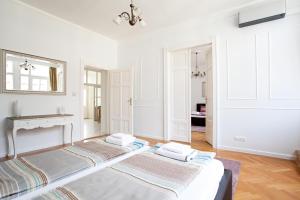 Posteľ alebo postele v izbe v ubytovaní Chic & Charm Apartment