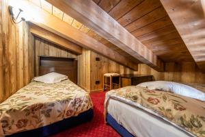 Postel nebo postele na pokoji v ubytování Hotel L' Aiglon