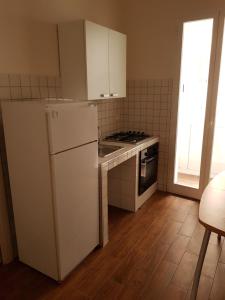 Kuchyň nebo kuchyňský kout v ubytování B&B da Mammina