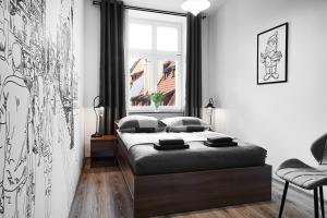 Łóżko lub łóżka w pokoju w obiekcie Prestige Apartments 7