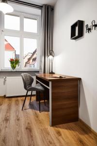 Telewizja i/lub zestaw kina domowego w obiekcie Prestige Apartments 7