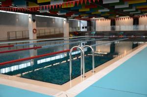 a large swimming pool in a building at Teknosports Otel in Istanbul