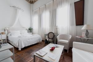 A bed or beds in a room at Palacio De Los Navas