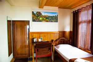 Postel nebo postele na pokoji v ubytování Dreamhome Stay