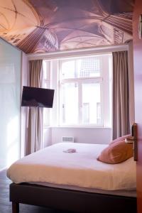 Voodi või voodid majutusasutuse Hotel Marcel toas
