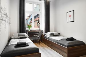 Łóżko lub łóżka w pokoju w obiekcie Prestige Apartments 7