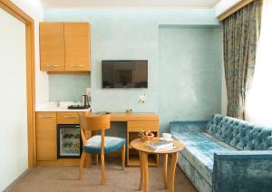 Kuchyň nebo kuchyňský kout v ubytování Cumbali Suite Hotel