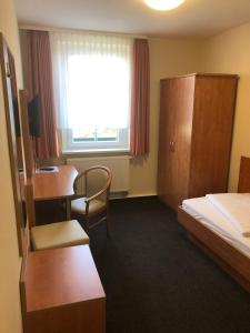 Postel nebo postele na pokoji v ubytování Döbelts Hotel Schützenhaus Jessen