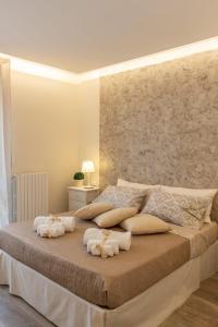 En eller flere senge i et værelse på La camelia bianca