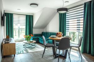 Posedenie v ubytovaní Apartamenty Leśna 1