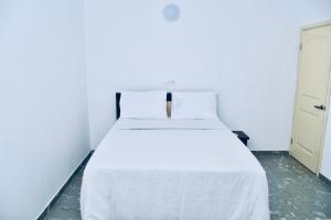 מיטה או מיטות בחדר ב-Hôtel La Couronne RW