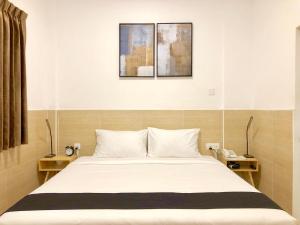 Letto o letti in una camera di K.C Residence