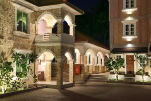 a courtyard of a building at night at K.C Residence in Yangon