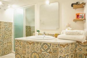 a bathroom with a sink and a shower at Donna Mariella in Naples