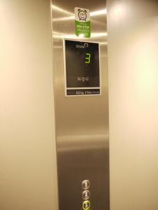 a silver elevator with a sign on top of it at Hotel Maravillas del Mundo in Calpe