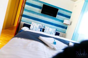 A bed or beds in a room at Pál Villa - Premium Apartments - Kecskemét