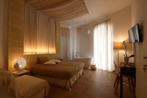 Posteľ alebo postele v izbe v ubytovaní San Michele Luxury Rooms