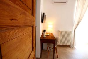 Televízia a/alebo spoločenská miestnosť v ubytovaní San Michele Luxury Rooms