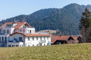 a white house on top of a hill at Chalet-Pfronten in Pfronten