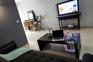 TV o dispositivi per l'intrattenimento presso Appartements Cayenne Standing