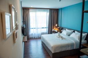 Postel nebo postele na pokoji v ubytování O&G Hotel Parit Buntar