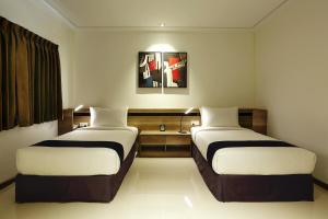 Katil atau katil-katil dalam bilik di K.C Hotel