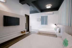 Postel nebo postele na pokoji v ubytování Starrywhale hostel