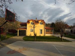 a basketball court in front of a house at Family House Near Motorway 6 Guests 3 Bedrooms in Veles
