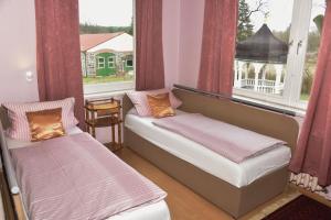Un pat sau paturi într-o cameră la Gutshaus Darsikow