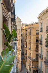 
a city street filled with lots of tall buildings at Hostal Sol y K in Barcelona
