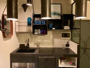 a kitchen with a sink and a counter top at Fra Storia e Modernità in Milan