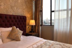 Letto o letti in una camera di Omart Hotel - Gallery