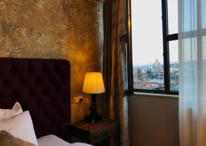 Letto o letti in una camera di Omart Hotel - Gallery