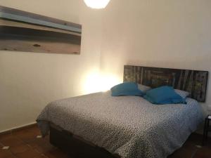 Ένα ή περισσότερα κρεβάτια σε δωμάτιο στο Casa Maria