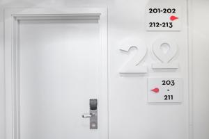 an open door with a thermometer next to it at Stay Hotel Faro Centro in Faro