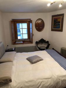 A bed or beds in a room at Les Cheminées