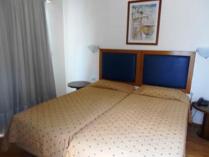 Postel nebo postele na pokoji v ubytování Adams Hotel