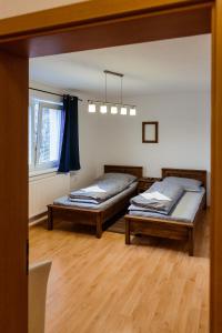 Postel nebo postele na pokoji v ubytování Apartmány Hrady