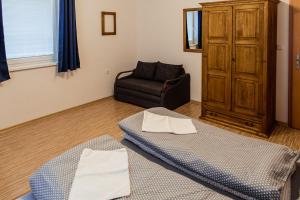 Postel nebo postele na pokoji v ubytování Apartmány Hrady