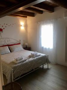 Postel nebo postele na pokoji v ubytování La Corte di Rosa