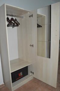 a walk in closet with a glass door at Miramar Pansiyon in Kaş