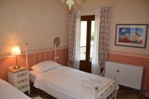 Ένα ή περισσότερα κρεβάτια σε δωμάτιο στο MELISSANDRAS VIEW HOUSE
